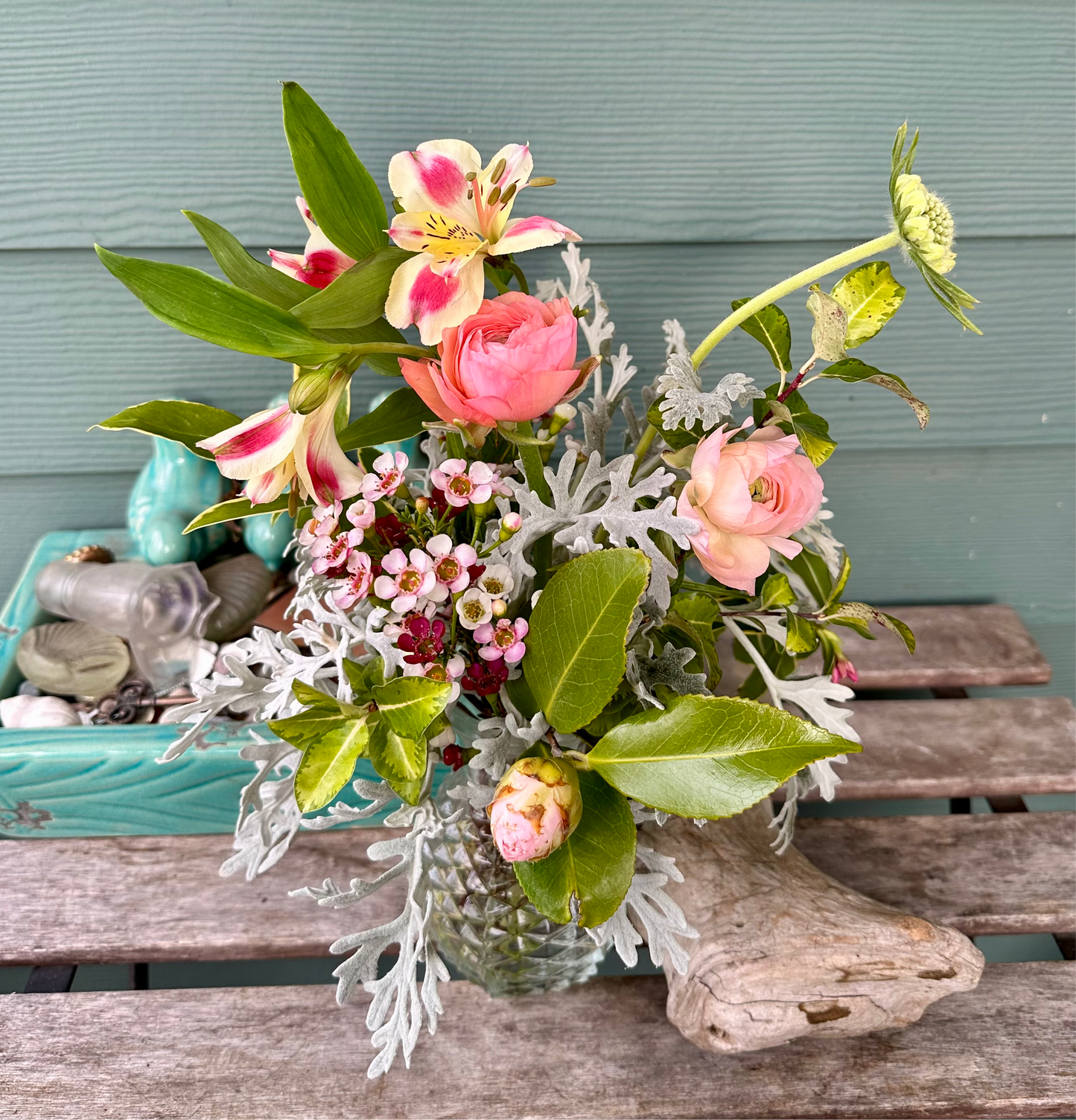 Small-ish Valentine’s flower arrangement in a second-hand vase. Featuring pink ranunculus, local greenery, and pink/magenta filler flowers. Garden-style and slightly asymmetrical with 100% locally grown flowers 