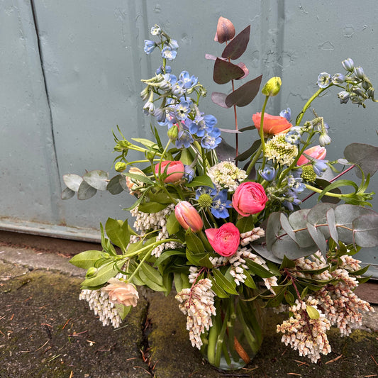 seasonal designer's choice florals in glass vase
